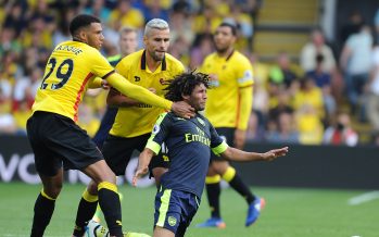 WATFORD, ENGLAND - AUGUST 27: Mohamed Elneny of Arsenal pulled back by Watford's Etienne Capoue during the Premier League match between Watford and Arsenal at Vicarage Road on August 27, 2016 in Watford, England. (Photo by Stuart MacFarlane/Arsenal FC via Getty Images) *** Local Caption *** Mohamed Elneny;Etienne Capoue