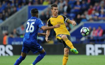 LEICESTER, ENGLAND - AUGUST 20: Alex Oxlade-Chamberlain of Arsenal takes on Riyad Mahrez of Leicester during the Premier League match between Leicester City and Arsenal at The King Power Stadium on August 20, 2016 in Leicester, England. (Photo by Stuart MacFarlane/Arsenal FC via Getty Images) *** Local Caption *** Laurent Koscielny;Riyad Mahrez