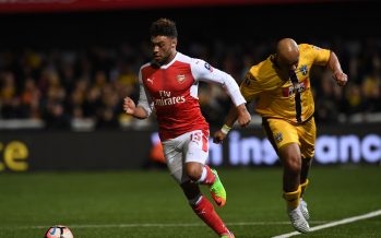 SUTTON, GREATER LONDON - FEBRUARY 20: Alex Oxlade-Chamberlain of Arsenal breaks past Simon Downer of Sutton during the Emirates FA Cup Fifth Round match between Sutton United and Arsenal on February 20, 2017 in Sutton, Greater London. (Photo by Stuart MacFarlane/Arsenal FC via Getty Images) *** Local Caption *** Alex Oxlade-Chamberlain;Simon Downer