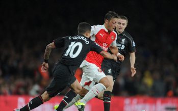 LONDON, ENGLAND - AUGUST 24: Mesut Ozil of Arsenal burts between Countinho and Jordan Rossiter of Liverpool during the Barclays Premier League match between Arsenal and Liverpool on August 24, 2015 in London, United Kingdom. (Photo by David Price/Arsenal FC via Getty Images) *** Local Caption *** Mesut Ozil; Oezil; Countinho; Jordan Rossiter