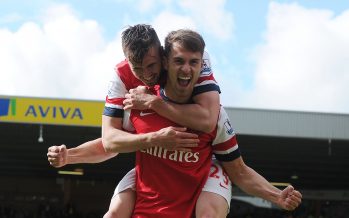 NORWICH, ENGLAND - MAY 11: Arsenal's Aaron Ramsey celebrates his goal with Carl Jenkinson during the Barclays Premier League match between Norwich City and Arsenal at Carrow Road on May 11, 2014 in Norwich, England. (Photo by Stuart MacFarlane/Arsenal FC via Getty Images) *** Local Caption *** Aaron Ramsey;Carl Jenkinson