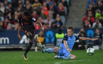 SYDNEY, AUSTRALIA - JULY 13: Joe Willock of Arsenal shoots under pressure from Brandon O'Neill of Sydney FC during the match between Sydney FC and Arsenal at ANZ Stadium on July 13, 2017 in Sydney, Australia. (Photo by David Price/Arsenal FC via Getty Images) *** Local Caption *** Joe Willock; Brandon O'Neill