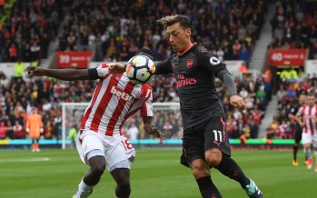 STOKE ON TRENT, ENGLAND - AUGUST 19: Mesut Ozil of Arsenal takes on Mame Diouf of Stoke during the Premier League match between Stoke City and Arsenal at Bet365 Stadium on August 19, 2017 in Stoke on Trent, England. (Photo by Stuart MacFarlane/Arsenal FC via Getty Images) *** Local Caption *** Mesut Ozil;Oezil;Mame Diouf
