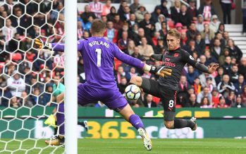STOKE ON TRENT, ENGLAND - AUGUST 19: Arsenal's Aaron Ramsey has his shot saved by Stoke goalkeeper Jack Butland during the Premier League match between Stoke City and Arsenal at Bet365 Stadium on August 19, 2017 in Stoke on Trent, England. (Photo by Stuart MacFarlane/Arsenal FC via Getty Images) *** Local Caption *** Aaron Ramsey;Jack Butland