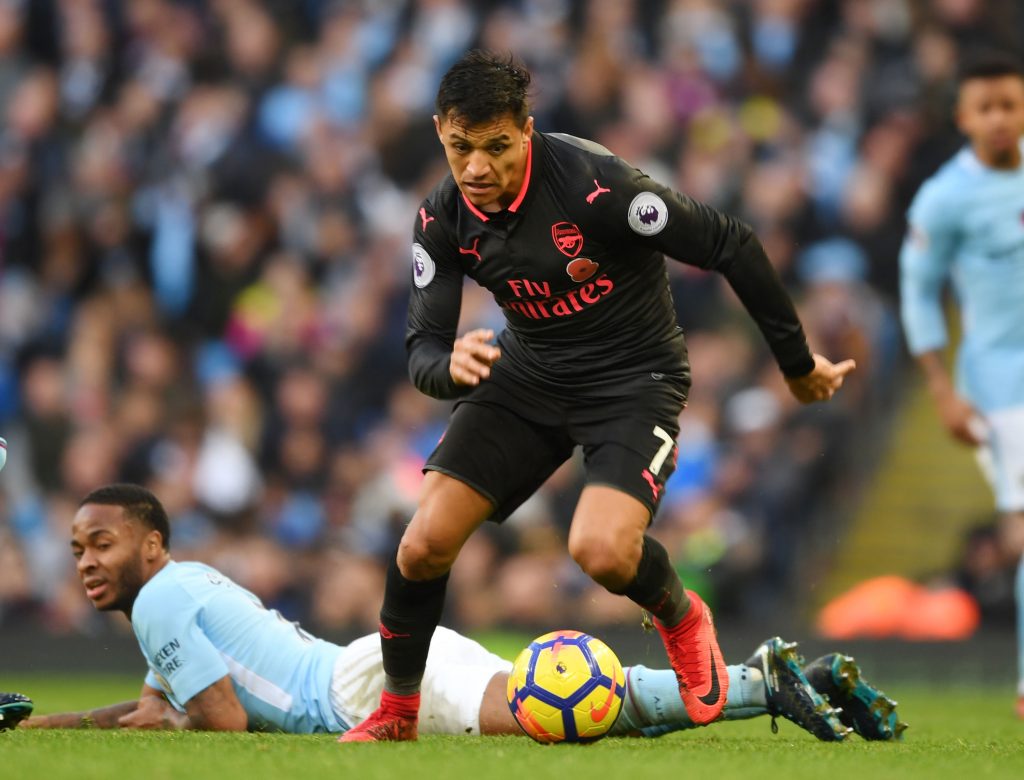 MANCHESTER, ENGLAND - NOVEMBER 05: Alexis Sanchez of Arsenal breaks past Raheem Sterling of Man City during the Premier League match between Manchester City and Arsenal at Etihad Stadium on November 5, 2017 in Manchester, England. (Photo by Stuart MacFarlane/Arsenal FC via Getty Images) *** Local Caption *** Alexis Sanchez;Raheem Sterling