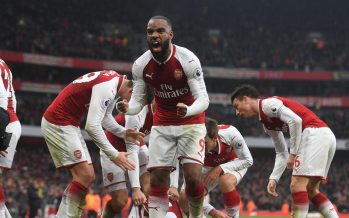 LONDON, ENGLAND - NOVEMBER 18: Alex Lacazette celebrates the 1st Arsenal goal scored by Shkodran Mustafi during the Premier League match between Arsenal and Tottenham Hotspur at Emirates Stadium on November 18, 2017 in London, England. (Photo by Stuart MacFarlane/Arsenal FC via Getty Images) *** Local Caption *** Alex Lacazette