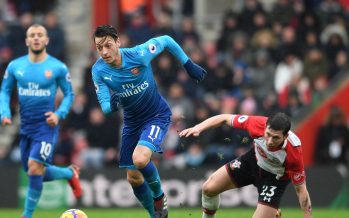 SOUTHAMPTON, ENGLAND - DECEMBER 09: Mesut Ozil of Arsenal takes on Pierre-Emile Hojbjerg of Southampton during the Premier League match between Southampton and Arsenal at St Mary's Stadium on December 10, 2017 in Southampton, England. (Photo by David Price/Arsenal FC via Getty Images) *** Local Caption *** Mesut Ozil; Oezil; Pierre-Emile Hojbjerg