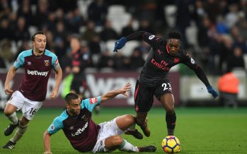 LONDON, ENGLAND - DECEMBER 13: Danny Welbeck of Arsenal is challenged by Winston Reid of West Ham during the Premier League match between West Ham United and Arsenal at London Stadium on December 13, 2017 in London, England. (Photo by David Price/Arsenal FC via Getty Images) *** Local Caption *** Danny Welbeck; Winston Reid