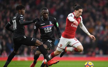 LONDON, ENGLAND - JANUARY 20: Hector Bellerin of Arsenal breaks past (L) Wilfred Zaha and (2ndL) Christian Benteke of Crystal Palace during the Premier League match between Arsenal and Crystal Palace at Emirates Stadium on January 20, 2018 in London, England. (Photo by Stuart MacFarlane/Arsenal FC via Getty Images) *** Local Caption *** Hector Bellerin;Wilfred Zaha;Christian Benteke