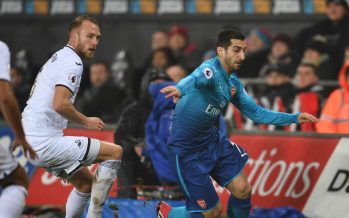 SWANSEA, WALES - JANUARY 30: Henrikh Mkhitaryan of Arsenal takes on Mike van der Hoorn of Swansea during the Premier League match between Swansea City and Arsenal at Liberty Stadium on January 30, 2018 in Swansea, Wales. (Photo by Stuart MacFarlane/Arsenal FC via Getty Images) *** Local Caption *** Henrikh Mkhitaryan;Mike van der Hoorn