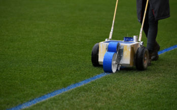 LONDON, ENGLAND - MARCH 01: The Arsenal groundstaff mark out the pitch with blue paint before the Premier League match between Arsenal and Manchester City at Emirates Stadium on March 1, 2018 in London, England. (Photo by David Price/Arsenal FC via Getty Images) *** Local Caption *** Arsenal groundstaff