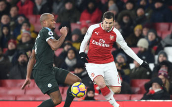 LONDON, ENGLAND - MARCH 01: Henrikh Mkhitaryan of Arsenal takes on Vincent Kompany of Man City during the Premier League match between Arsenal and Manchester City at Emirates Stadium on March 1, 2018 in London, England. (Photo by Stuart MacFarlane/Arsenal FC via Getty Images) *** Local Caption *** Henrikh Mkhitaryan;Vincent Kompany