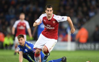 LEICESTER, ENGLAND - MAY 09: Henrikh Mkhitaryan of Arsenal breaks past Aleksandar Dragovic of Leicester during the Premier League match between Leicester City and Arsenal at The King Power Stadium on May 9, 2018 in Leicester, England. (Photo by Stuart MacFarlane/Arsenal FC via Getty Images) *** Local Caption *** Henrikh Mkhitaryan;Aleksandar Dragovic