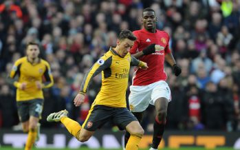 MANCHESTER, ENGLAND - NOVEMBER 19: Mesut Ozil of Arsenal breaks past Paul Pogba of Man United during the Premier League match between Manchester United and Arsenal at Old Trafford on November 19, 2016 in Manchester, England. (Photo by Stuart MacFarlane/Arsenal FC via Getty Images) *** Local Caption *** Mesut Ozil;Oezil;Paul Pogba