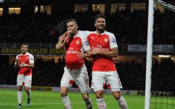 WATFORD, ENGLAND - OCTOBER 17: (L) Aaron Ramsey celebrates soring the 3rd Arsenal goal with (R) Olivier Giroud during the Barclays Premier League match between Watford and Arsenal at Vicarage Road on October 17, 2015 in Watford, England. (Photo by Stuart MacFarlane/Arsenal FC via Getty Images) *** Local Caption *** Aaron Ramsey;Olivier Giroud