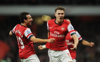LONDON, ENGLAND - NOVEMBER 02: (R) Aaron Ramsey celebrates scoring the 2nd Arsenal goal with (L) Santi Cazorla during the Barclays Premier League match between Arsenal and Liverpool at Emirates Stadium on November 02, 2013 in London, England. (Photo by Stuart MacFarlane/Arsenal FC via Getty Images) *** Local Caption *** Aaron Ramsey;Santi Cazorla